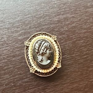 Elegant Cameo Brooch with Gold and Black Accents